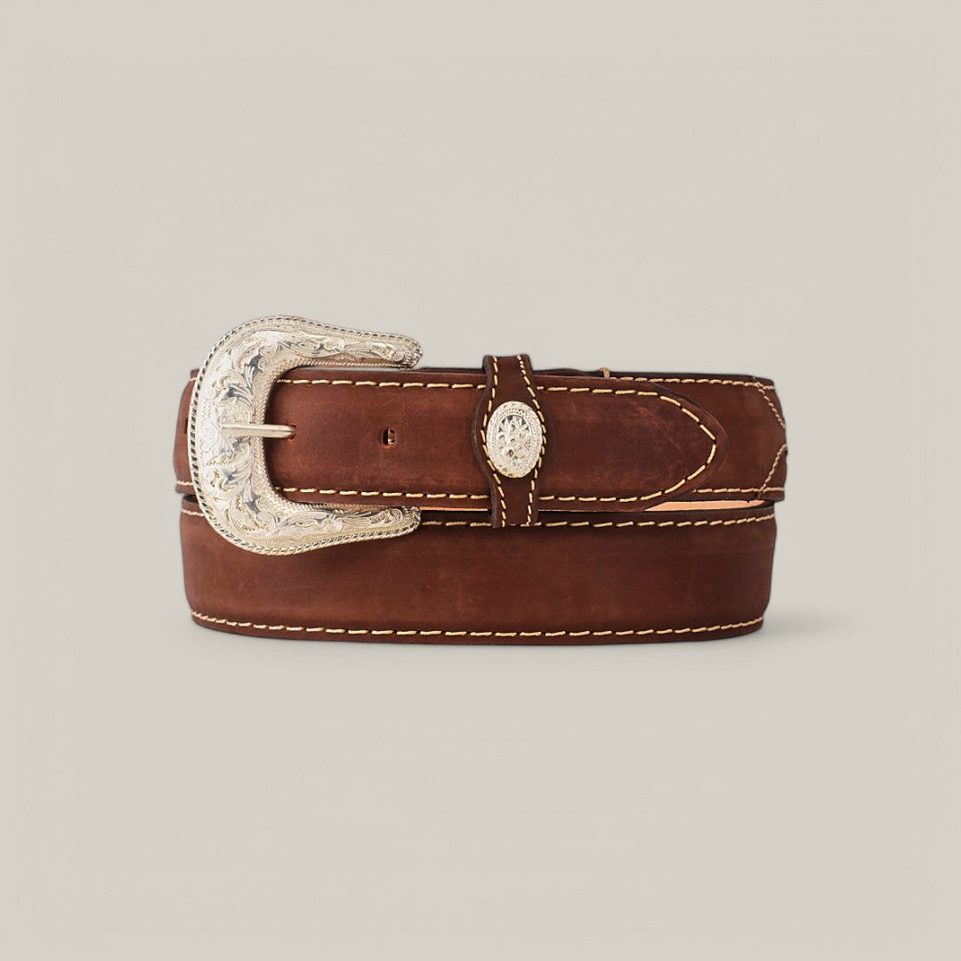 The Tan Plain Belt - Silver Buckle features a coiled design with visible stitching and an ornate silver buckle. Intricate designs add a decorative touch, while the neutral tan background highlights its elegance and versatile style.