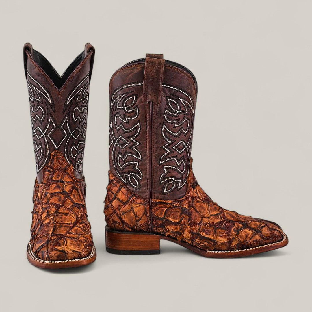 Exotic Patchwork Pirarucu Fish - Matte Brown - Square Toe boots feature intricate white stitching and textured, patterned leather, shown against a plain background—a standout piece in luxury footwear.