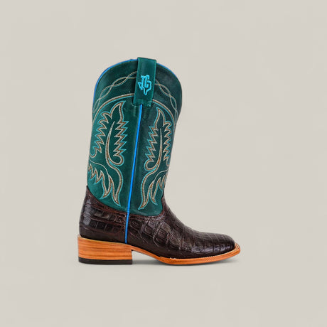 The Exotic Caiman Horn Back - Dark Brown - Square Toe boot features a dark brown caiman leather foot, tall teal shaft with yellow stitching, and a wooden heel, shown on a plain light background.