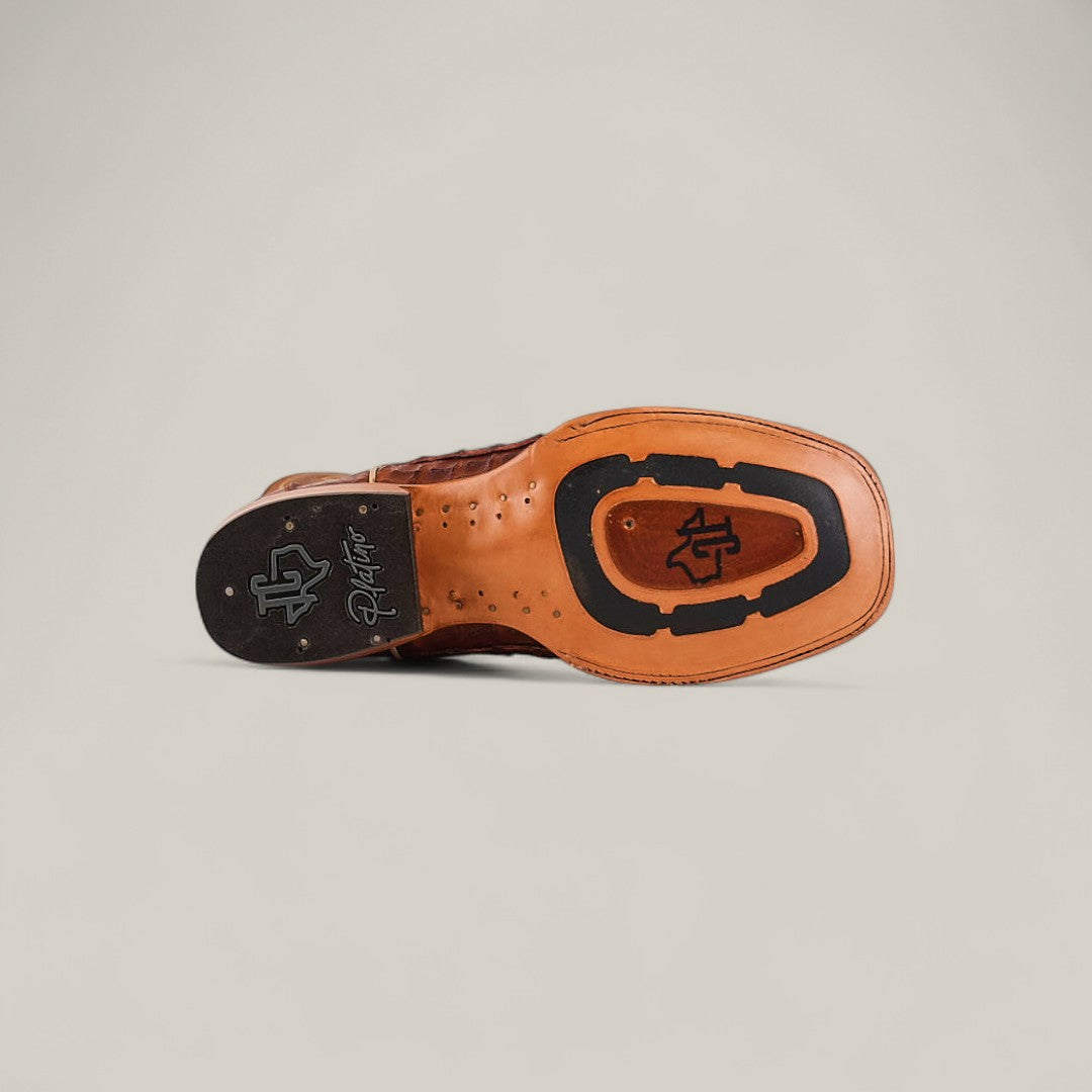 The Exotic Caiman Belly Tail - Brandy - Square Toe shoe features a black rubber grip sole with decorative stitching, a logo, and the word Player near the heel, combining classic style with distinctive square toe design.