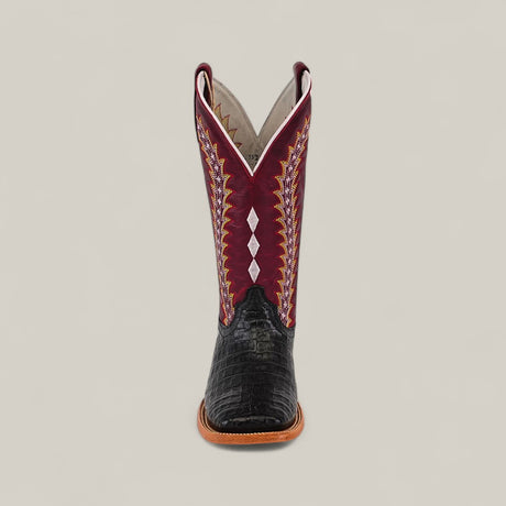 Front view of the Exotic Caiman Horn Back - Black - Square Toe boot, featuring a black textured caiman toe, brown sole, and a tall maroon shaft with multicolored embroidery and white diamond-shaped accents.