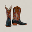 A pair of Exotic Python - Dark Blue - Square Toe boots with brown leather shafts, blue and orange flame stitching, and black textured reptile-patterned lowers, from the Platinum Collection, displayed against a neutral background.