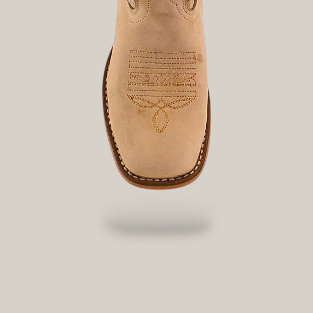 The Premiere Suede Bone - Square Toe - Kids boots are tan suede boots with decorative toe stitching, a rounded square front, and viewed from above against a light beige background with a soft shadow.