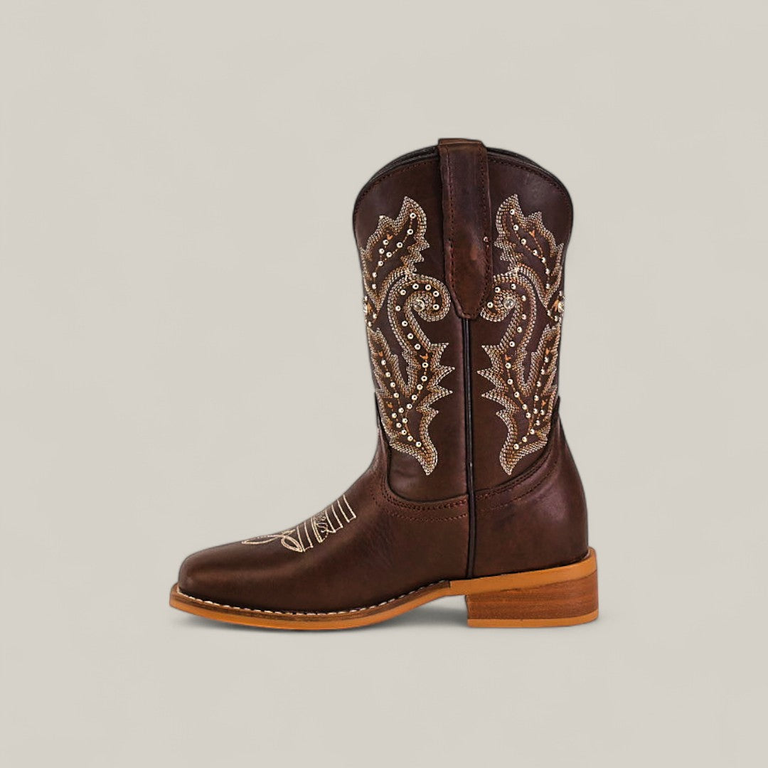 A single Britany Brown - Square Toe - Kids Boot, showcasing decorative embroidery, stud accents, wooden heel, pull straps, and quality craftsmanship, displayed against a plain light background.