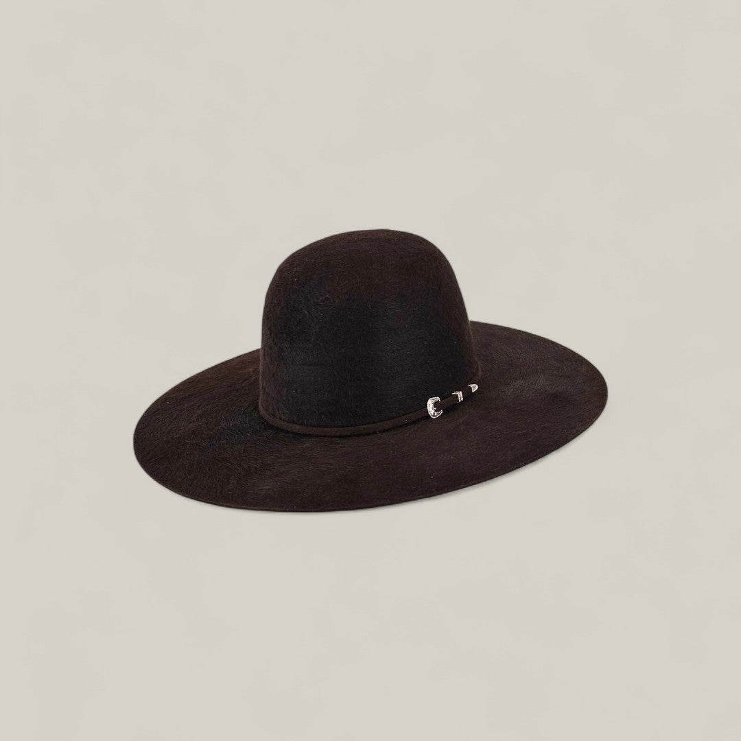 The 10X Grizzly - Tacchino is a wide-brimmed black open crown felt hat featuring a rounded crown and a small silver buckle on the band—a timeless luxury accessory displayed against a plain light background.