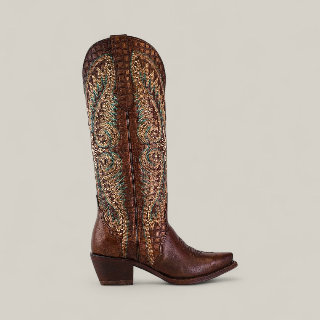 The Rachael Copper - Tall Shaft - Snip Toe boot is a tall brown leather womens style with multicolored stitched patterns, textured details, a slightly angled heel, and pointed toe, shown against a plain light background.