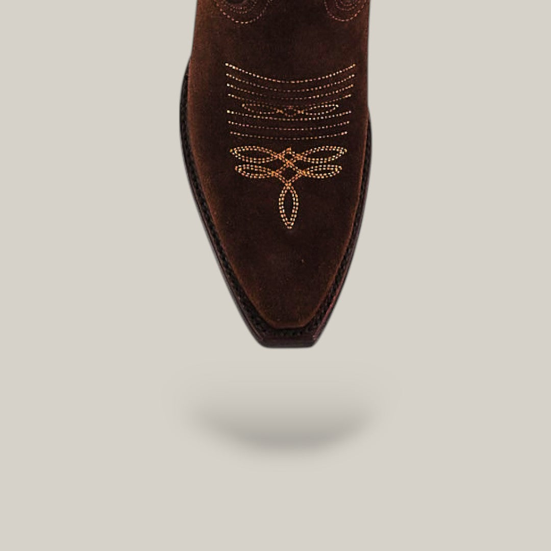 A close-up of the Kellie Suede Brownie Leather Sole cowboy boot, featuring a tall shaft and snip toe in dark brown suede with intricate light embroidery, displayed against a plain light background with a subtle shadow below.