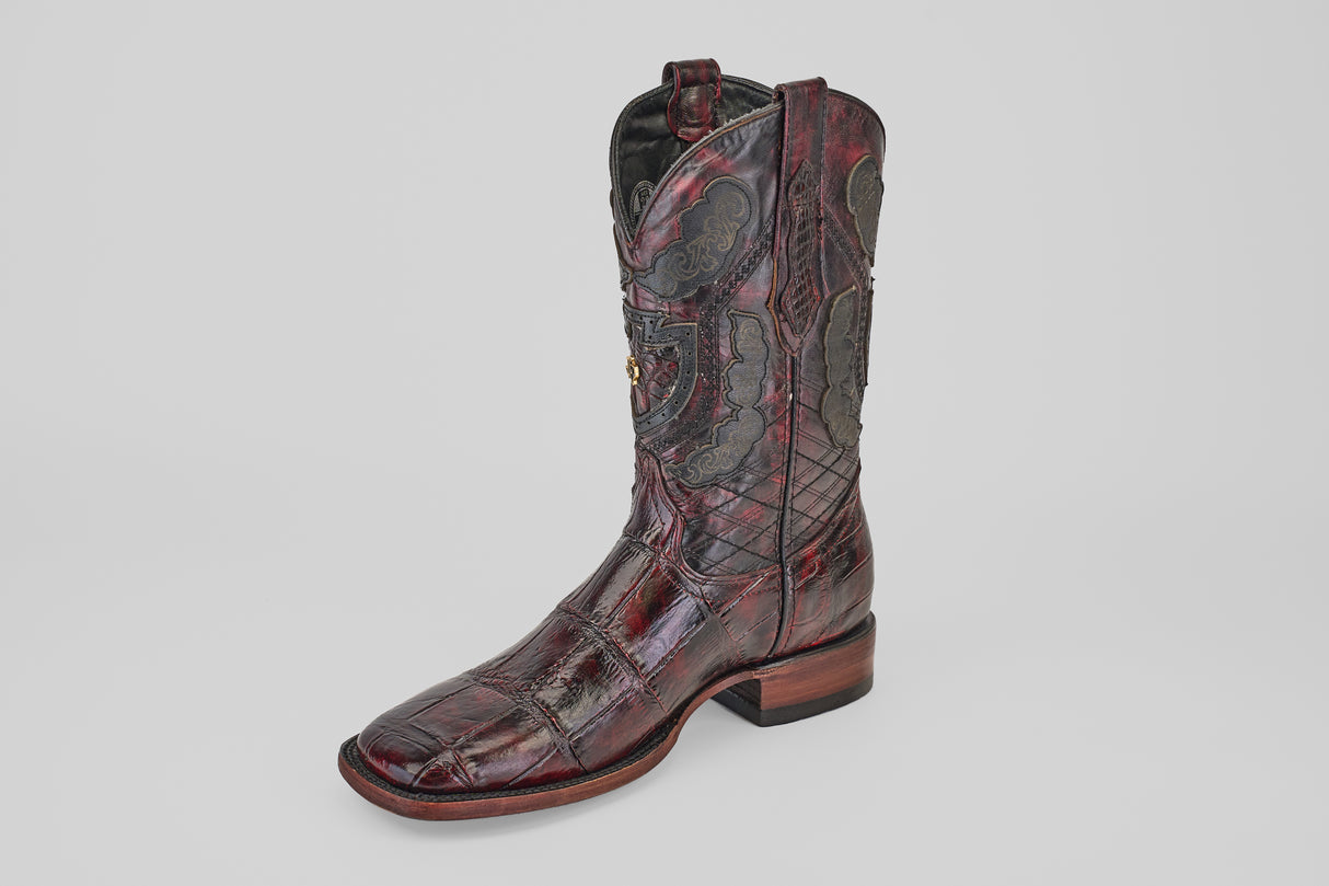 The Exotic Alligator - BlackCherry- Square Toe boot features shiny, dark red and black alligator leather with ornate stitching, shown as a single decorative piece on a plain light gray background.