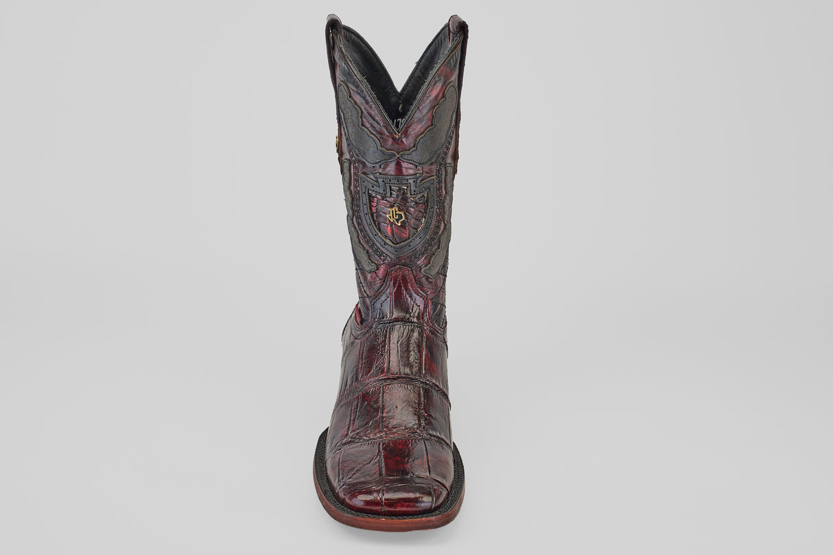 A single Exotic Alligator - BlackCherry- Square Toe cowboy boot with detailed stitching and an embossed crest, shown facing forward on a plain white background.