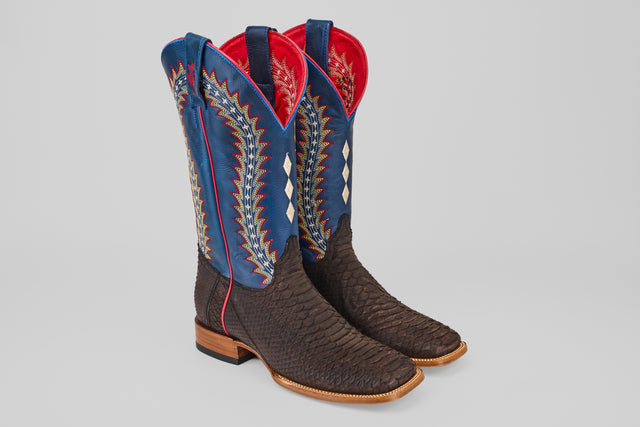 The Morgan - Matte Brown - Square Toe boots from the Diamond Collection feature textured dark brown leather feet, blue shafts with multicolored stitching, red lining, and wooden heels, shown on a light gray background.