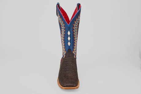 The Morgan - Matte Brown - Square Toe mens boot from the Diamond Collection showcases a textured dark brown lower, blue upper with white diamond and zigzag patterns, red lining, and a light brown sole on a gray background.