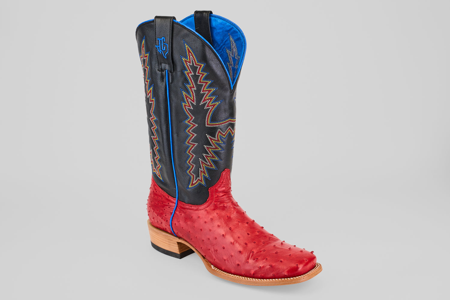 The Crowley - Red - Square Toe boots feature a red ostrich leather foot, black shaft with blue and orange stitching, blue lining, square toe, and a light brown stacked heel.