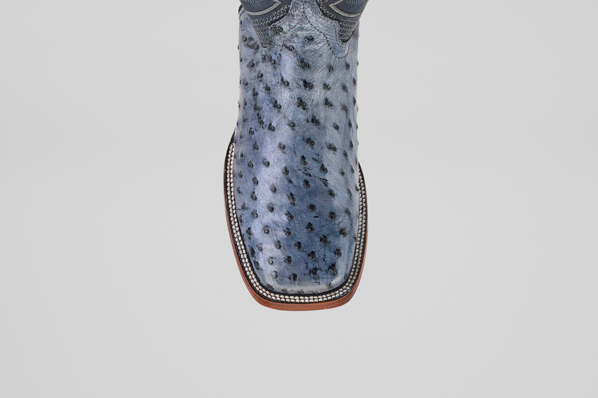 A close-up top view of the Exotic Full Quilt Ostrich boots in Safari Gray with a square toe and detailed stitching, displayed on a plain white background.