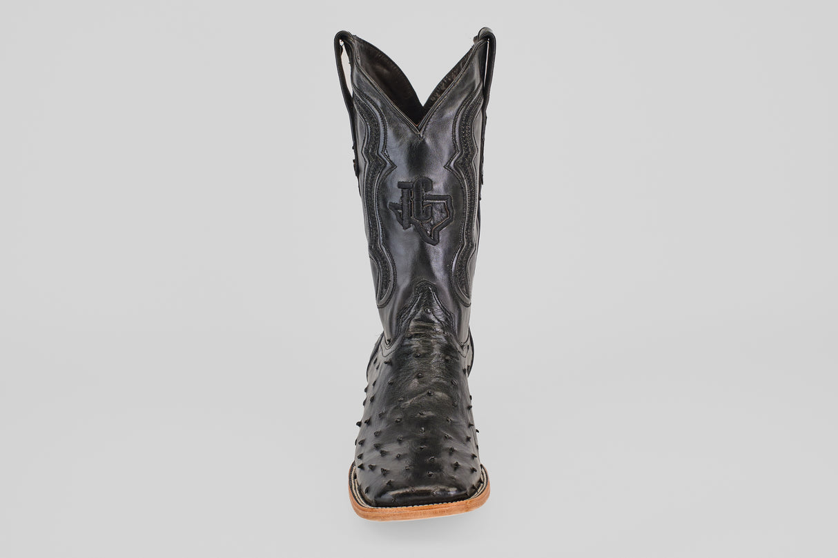 A single Austin - Black - Square Toe cowboy boot in black leather with decorative stitching and an avestruz-textured pattern on the foot, shown from the front against a plain light background.