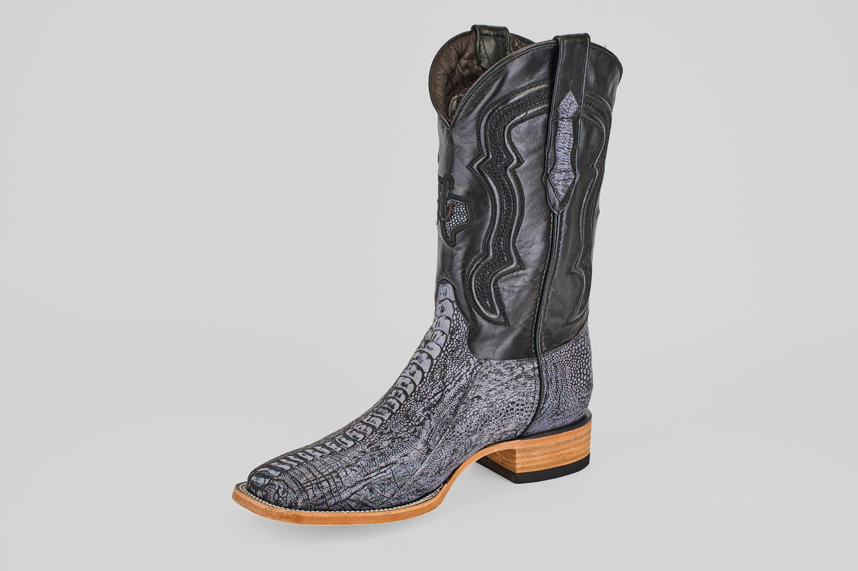 The Austin Leg - Blue Jean - Square Toe men's cowboy boot features a patterned grey lower resembling ostrich leather, a black upper shaft with decorative stitching, a light brown sole, and a low heel, shown against a white background.