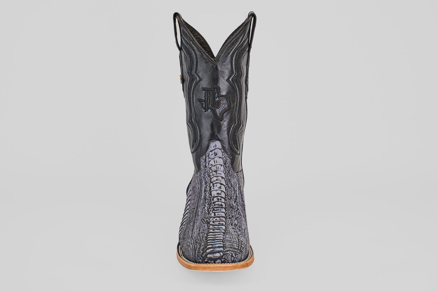 The Austin Leg - Blue Jean - Square Toe men's cowboy boot features a textured, reptile-like pattern and a light brown sole, displayed from the front against a white background—ideal for matching with blue jeans.