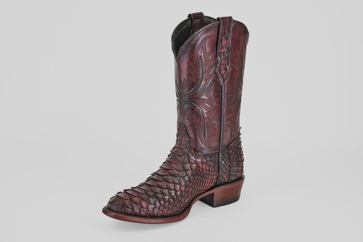 The Tanner Jumbo - Black Cherry - Round Toe is a single cowboy boot in dark cherry python leather, with decorative stitching on the tall shaft, a low heel, and a textured, scaly finish, shown against a plain light background.