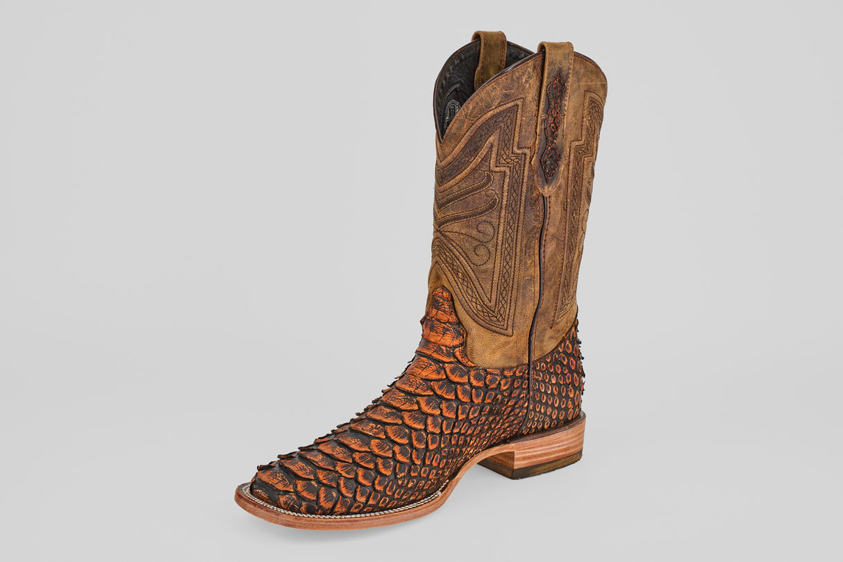 The Tanner Jumbo – Chestnut – Square Toe is a single cowboy boot crafted from python leather, featuring a distinctive scale-like texture and decorative stitching on the shaft, displayed against a plain light background.