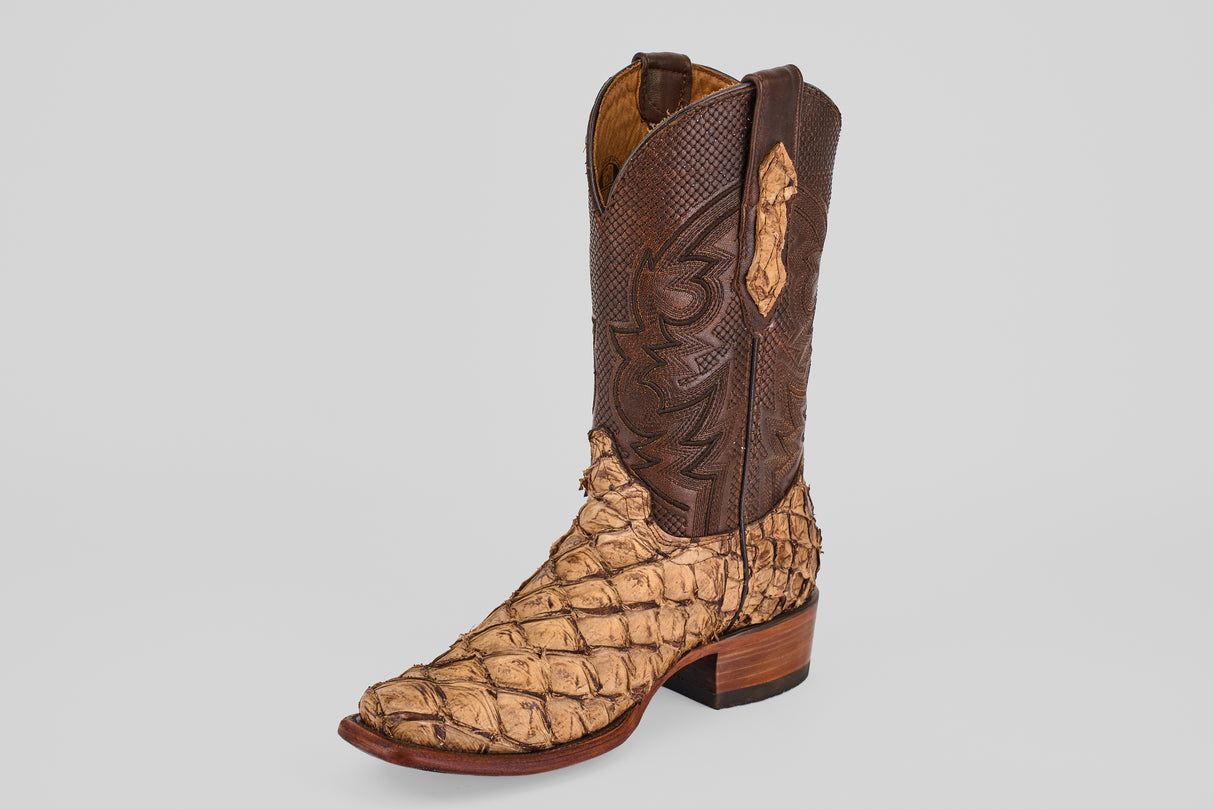 The Conor - Matte Orix boot features brown and tan Pirarucu leather, a narrow square toe, decorative stitching, and a medium wooden heel, shown against a plain light background.