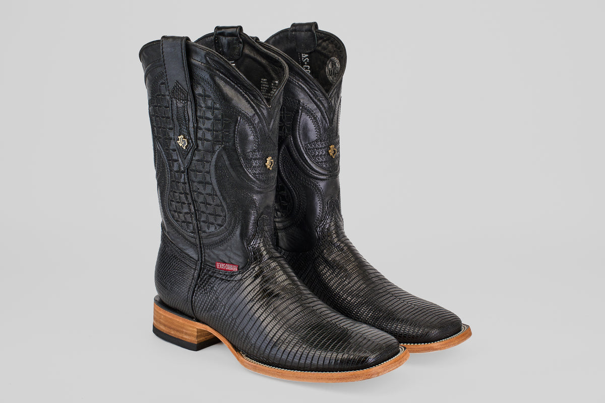 The Blaze – Black – Square Toe cowboy boots, made from genuine lizard leather with decorative stitching, wooden heels, and tan soles, are showcased against a light gray background.