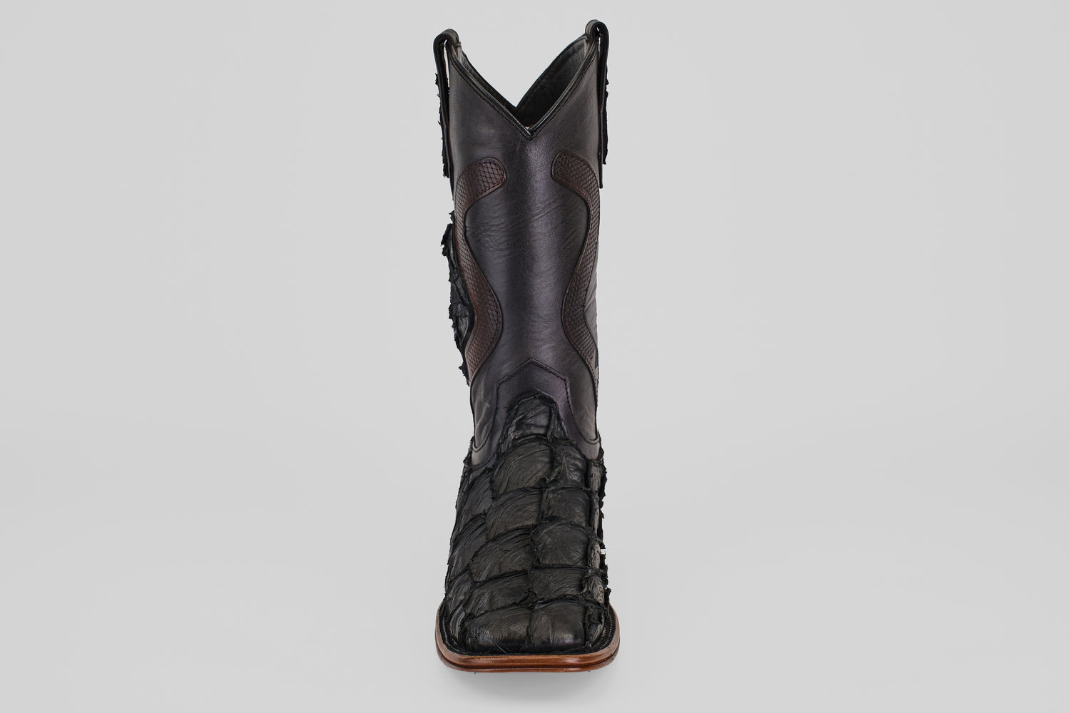 A single Conor Platinum - Matte Black - Square Toe (Diamond) boot, crafted from textured pirarucu leather with detailed stitching, is shown from the front against a plain light background.