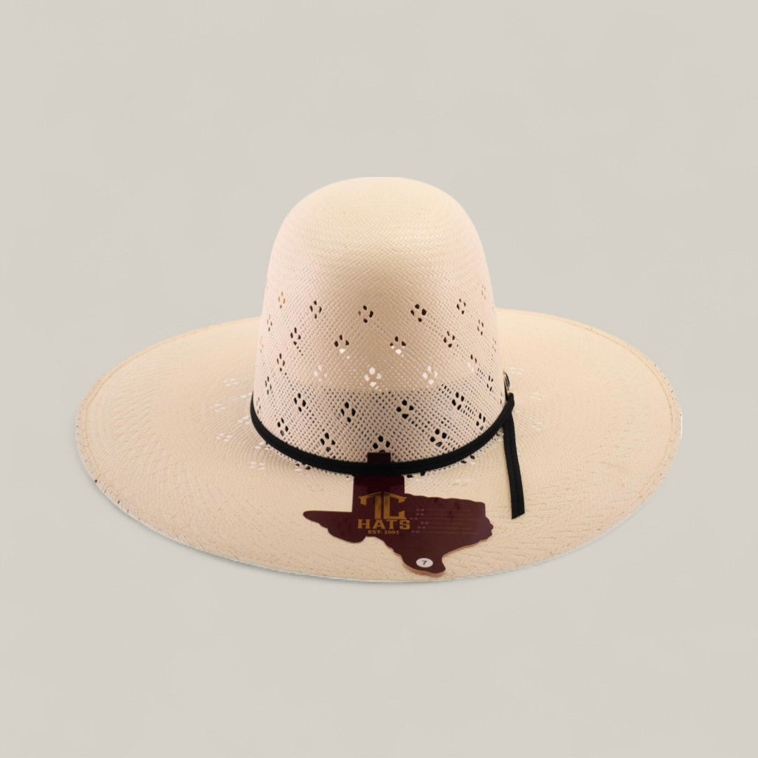 The 30X Clover - Open Crown is a wide-brimmed, light-colored straw hat with decorative cutouts, a black chin cord, and a Texas-shaped brown patch with yellow TC HATS text on the front. Displayed against a plain beige background.
