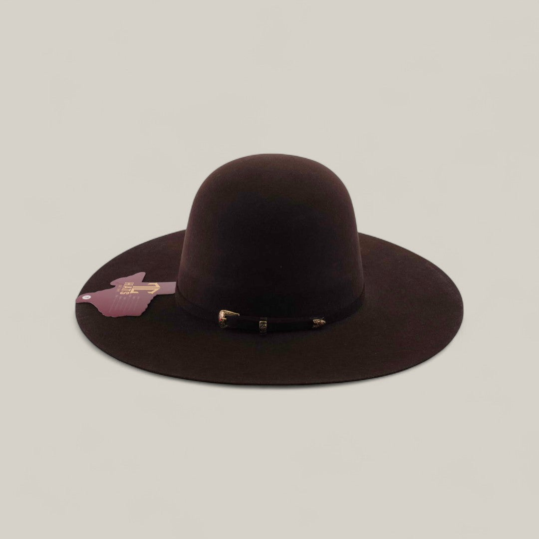 The 10X - Chocolate - TC Hats is a wide-brimmed, dark brown felt Western hat featuring a decorative band and attached tag, shown against a plain light background.