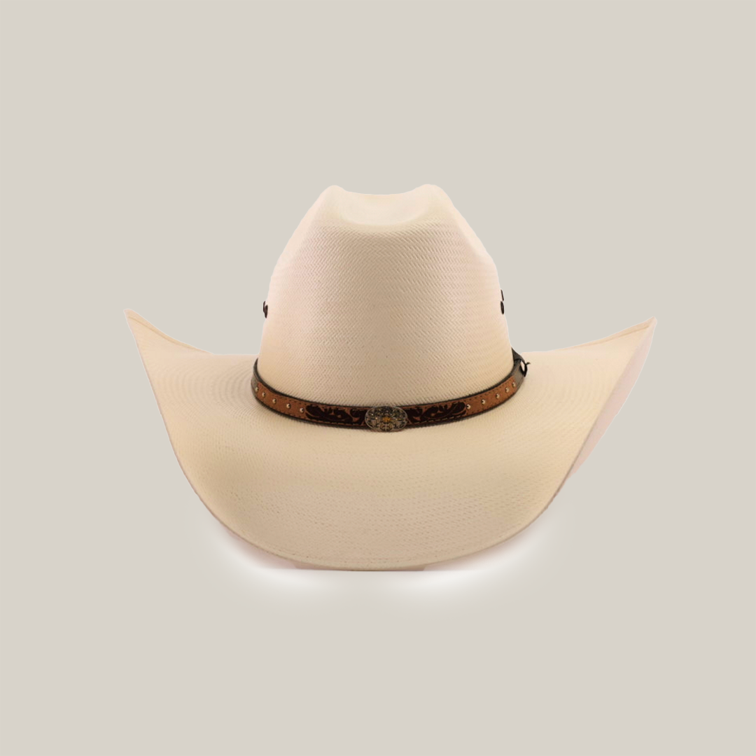 The 500X Bull Straw Hat embodies Western elegance with its wide brim and genuine leather band, highlighted by a metal concho around the crown, all seen from the front in classic white.