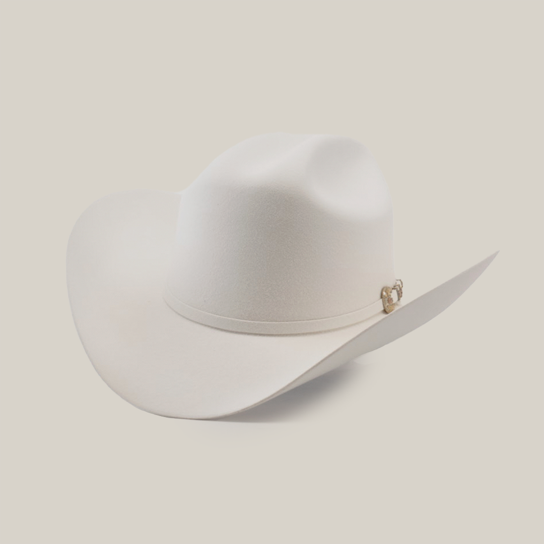 A white cowboy hat with a wide brim and a subtle decorative band around the base, set against a plain light background.