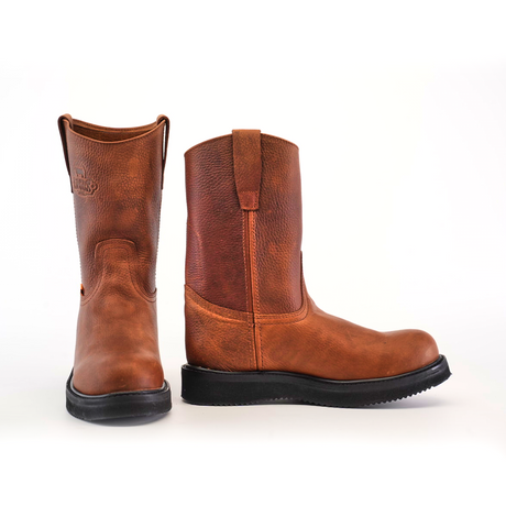 A pair of brown leather Brandy Roper boots with Laredo soles, crafted from premium cowhide leather, is displayed against a white background; one boot stands upright while the other tilts slightly, highlighting Western bootmaking heritage.