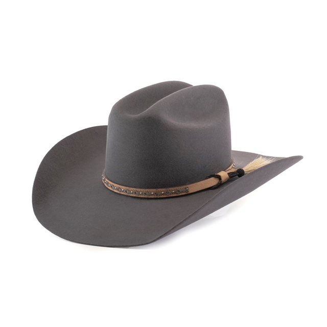 The 6X Doble SS Gris Oxford is a dark grey felt cowboy hat made from premium sheeps wool, featuring a wide brim and a decorative tan band with a small black tassel and light-colored horsehair tuft, elegantly angled against a white background.