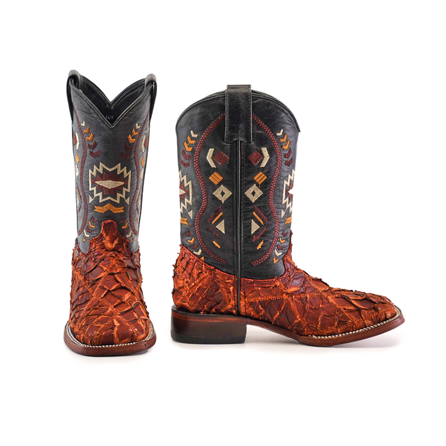 The Exotic Pirarucu Fish Patchwork Cogñac Square Toe boots feature square toes, dark shafts with geometric patterns, and textured reddish-brown leather. One boot faces forward, the other angled to showcase the heel and sole—a stunning patchwork of cognac style.