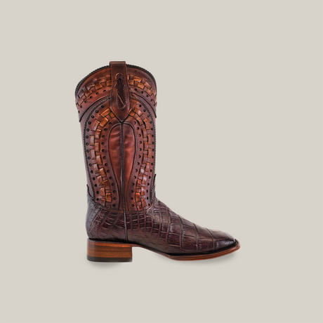 The Exotic American Alligator - Herradura - Tabaco boot displays classic Western style, featuring intricate stitching and an alligator-like texture. It has a Square Toe, Goodyear Welt Construction, and a wooden sole and heel, all set against a light neutral background.