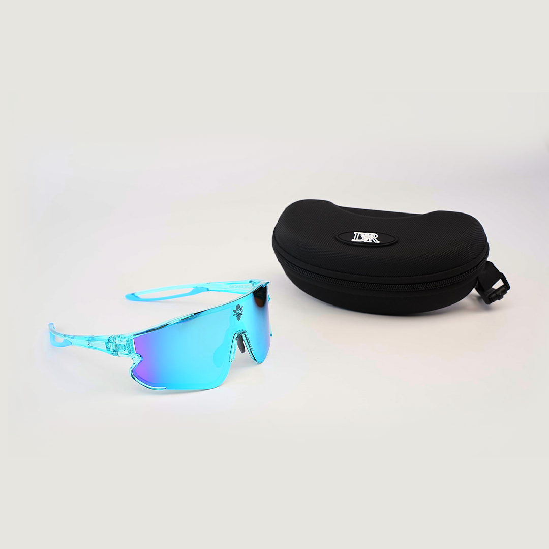 DR Sport Sunglasses Ice Blue with modern blue mirrored lenses and UV protection are shown on a light background. Positioned front left, they sit beside a black zippered case featuring the logo.