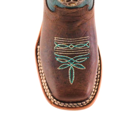 The Grecas Tabaco - Square Toe boot, crafted with traditional methods, features intricate turquoise embroidery with floral and geometric patterns. This brown western boot is made from premium leather and showcases a square toe with visible edge stitching.