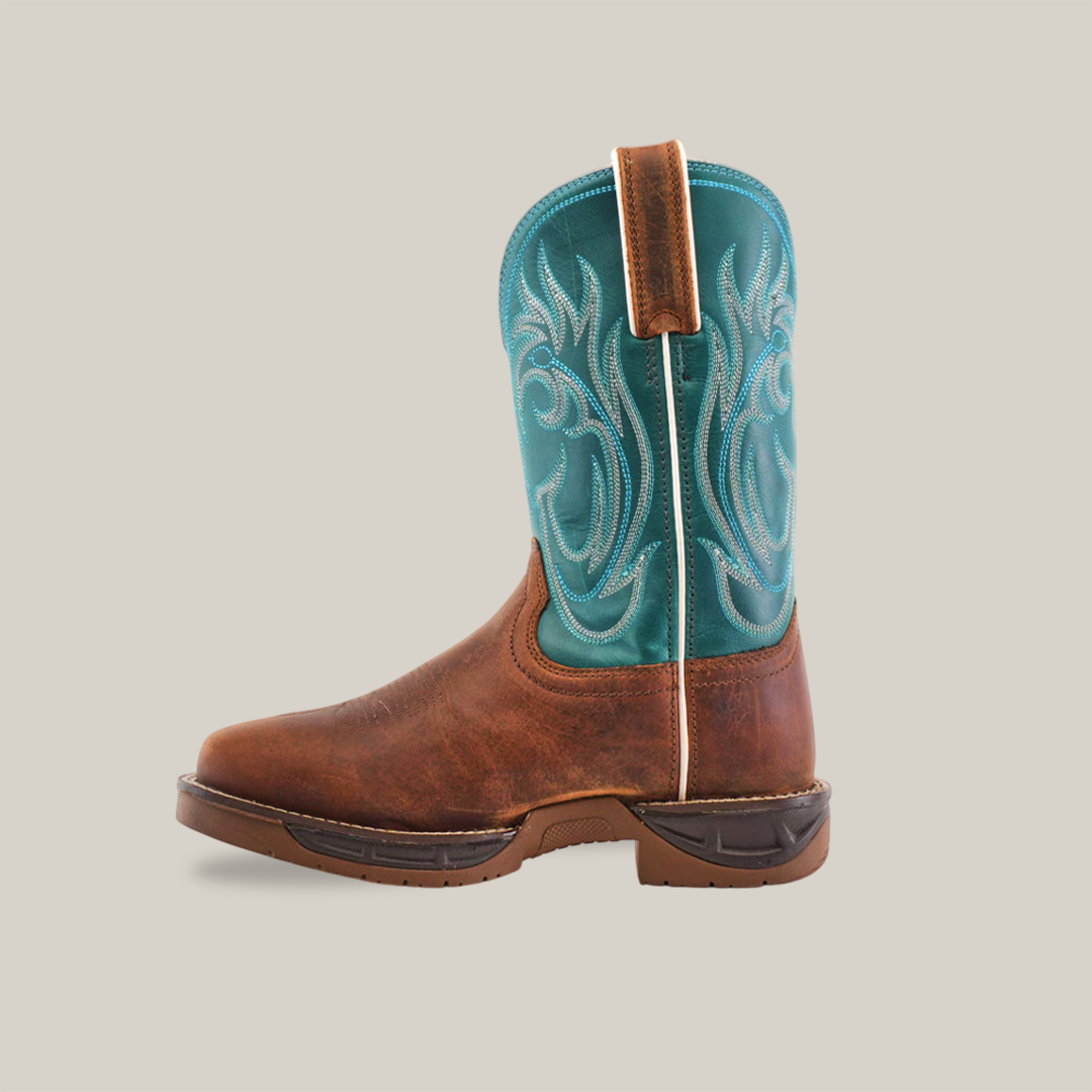 The Rustic Turquoise Brown boot, made from premium cowhide leather, features a brown foot and rustic turquoise upper with intricate embroidery. It is a waterproof, composite toe work boot shown in profile against a white background.