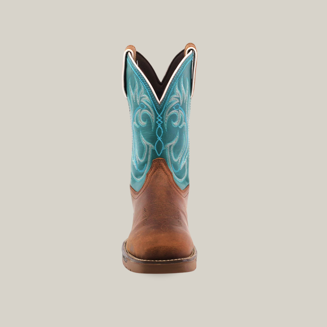 Close-up of the Rustic Turquoise Brown - Waterproof - Composite Toe boot, crafted from premium cowhide leather with intricate stitching on the square toe and visible white stitches lining the sole, set against a light, neutral background.