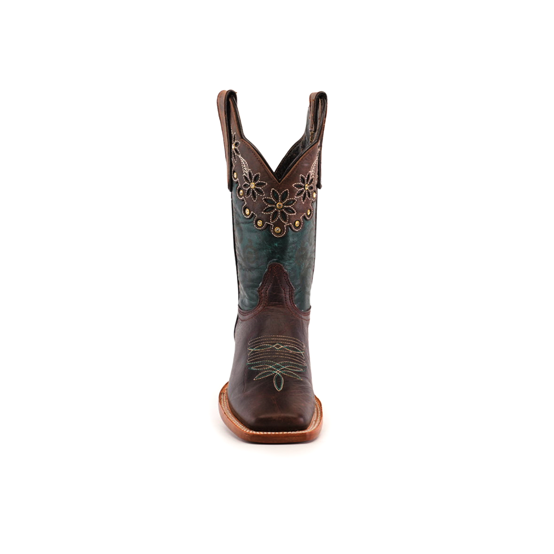 The Grecas Brown boot combines traditional craftsmanship with brown leather and turquoise accents. Its short shaft displays floral embroidery in gold and green thread. This luxurious western footwear features a square toe and wooden heel, all set against a white backdrop.