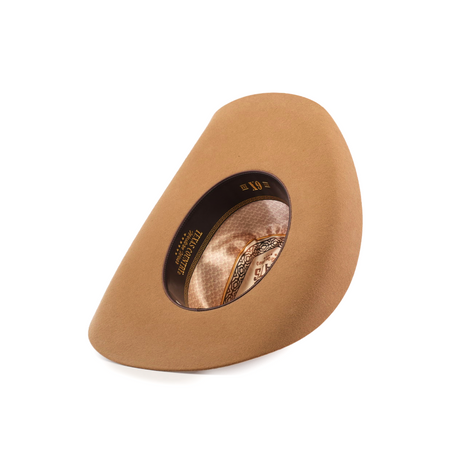 The 6X Chihuahua Fawn is a brown Western hat made from premium sheep wool, featuring an oval opening and intricate inner band designs, set against a white background.