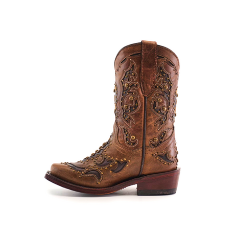 A brown cowhide leather cowboy boot, the Arass Studs Orix - Snip Toe, showcases intricate stitching and decorative studs on a white background. It has a low heel and a pull tab at the top.