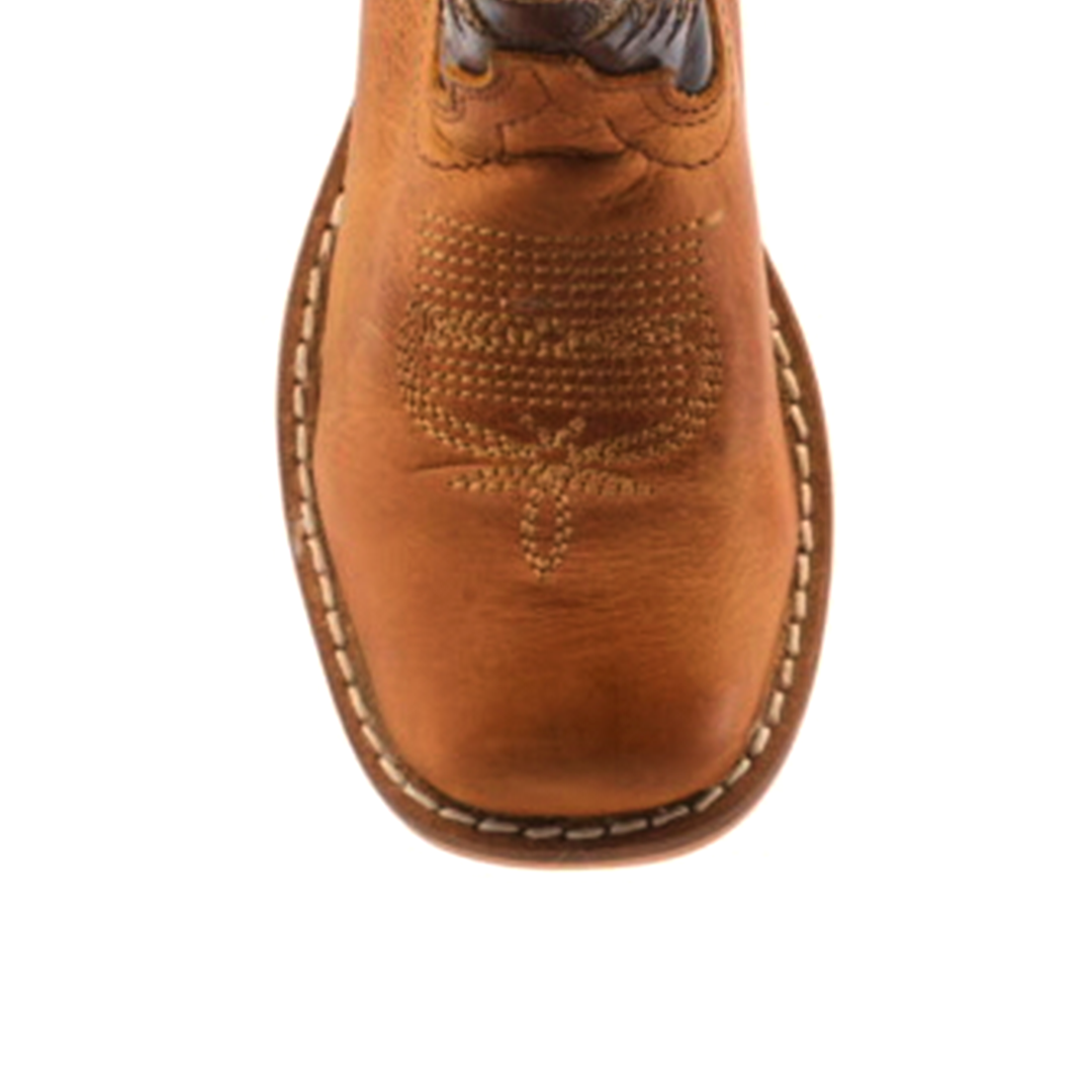 Top view of the handcrafted Cater Honey Square Toe boot, featuring intricate stitching on the cowhide leather with a square toe shape and a decorative pattern. A visible sole with a white stitch outline completes its refined look.