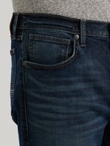 Close-up of someone wearing Wrangler 20X Sunnybrook Dark Wash Extreme Relaxed Straight Stretch Denim Jeans (112344469) and a gray shirt, focusing on the premium denims side, front pocket, and belt loops.