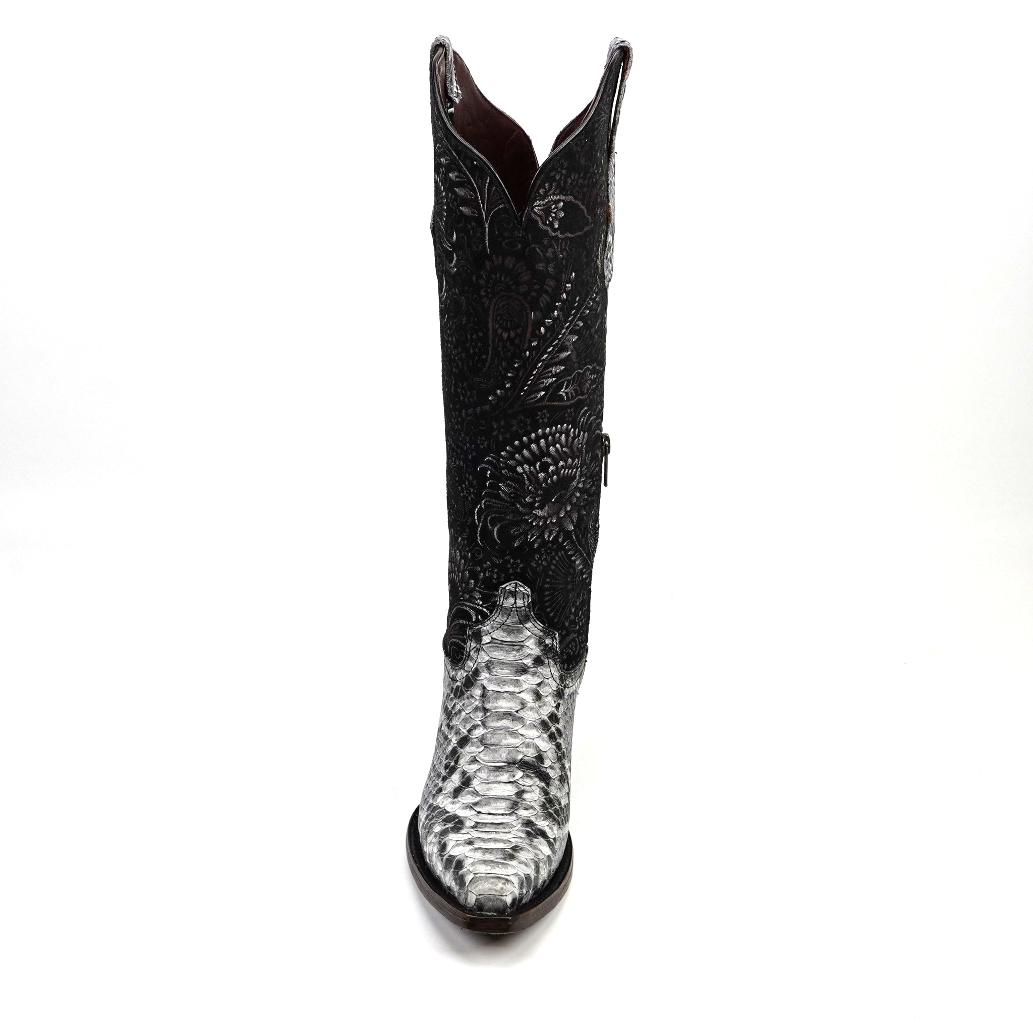 Black cowboy boot with intricate white patterns on a white background