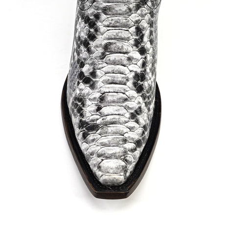 Close-up of a snake skin-patterned boot on a white background