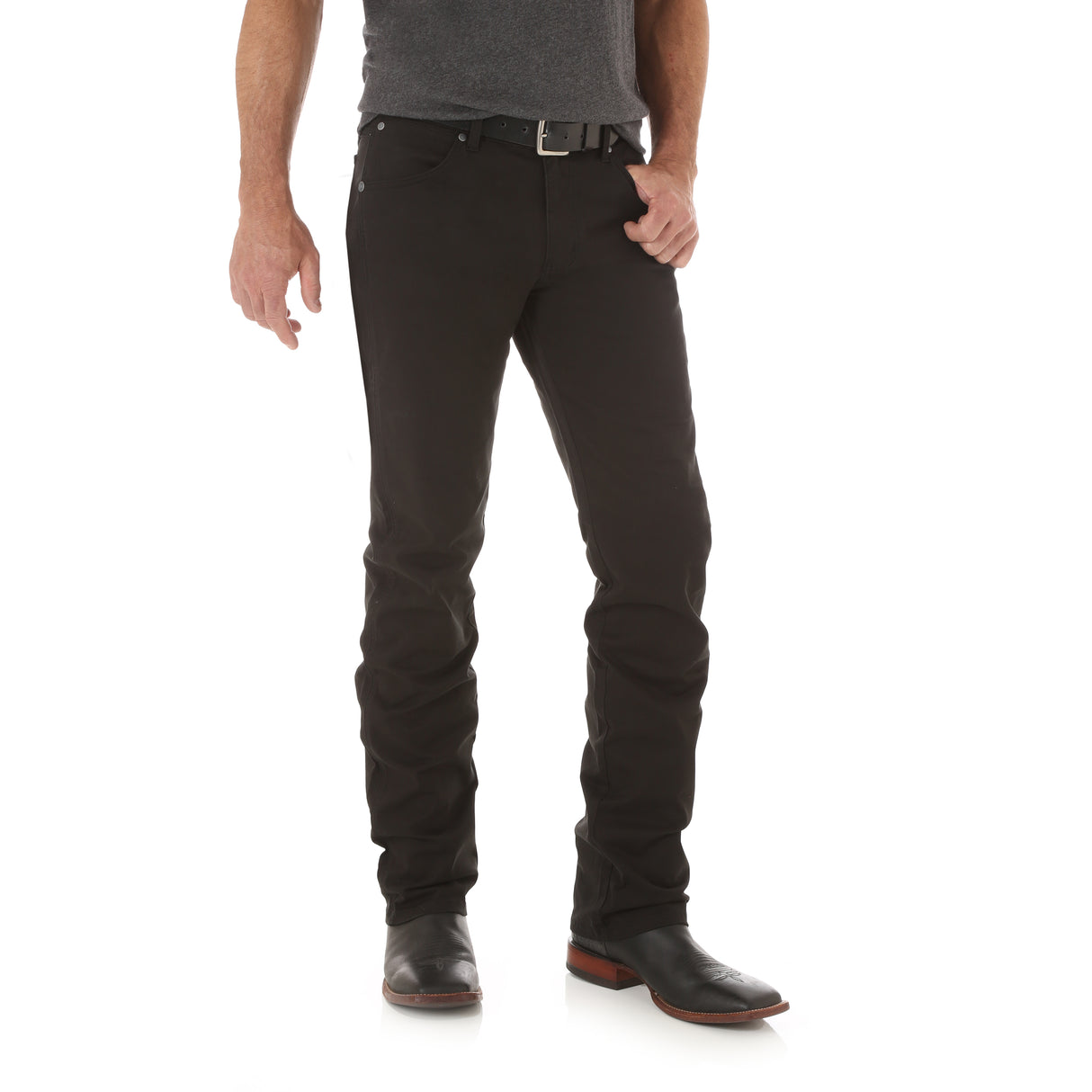 A person wears Mens Wrangler Retro Slim Fit Straight Leg Pants (88MWZBK) with a black belt and dark shoes. Their partly visible upper body features a dark gray shirt. The premium denim stands out against the white background.