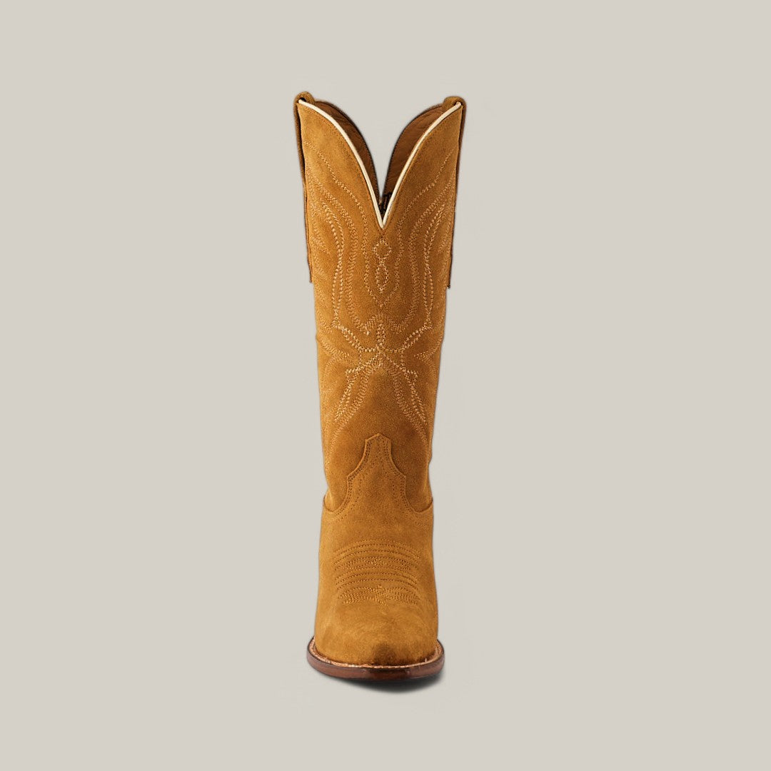 The Miranda Suede boot in gold leather stands upright, showcasing its snip toe, decorative white stitching, tan color, and slightly curved top edge against a plain background.