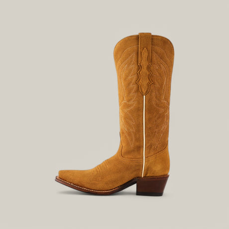 A single Miranda Suede Gold Leather Sole boot, featuring intricate stitching and a gold leather sole, is shown on a light gray background. This snip toe boot with mid shaft height perfectly blends rugged style with elegance.