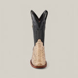 Front view of the Exotic Python - Natural boot displaying a textured light brown toe and black detailed upper. This boot has a narrow square toe, standard heel, and stitching accents on the shaft, seamlessly blending rustic and modern styles against a plain background.