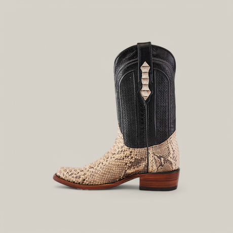 The Exotic Python - Natural - Narrow Square Toe boot has a black shaft, beige textured vamp with a reptile pattern, decorative stitching, pull strap, and wooden heel.