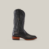 The Exotic American Alligator Belly - Black - Roper Toe boot, made from crocodile-patterned leather with intricate stitching, features a pointed toe and wooden heel against a plain light grey backdrop.